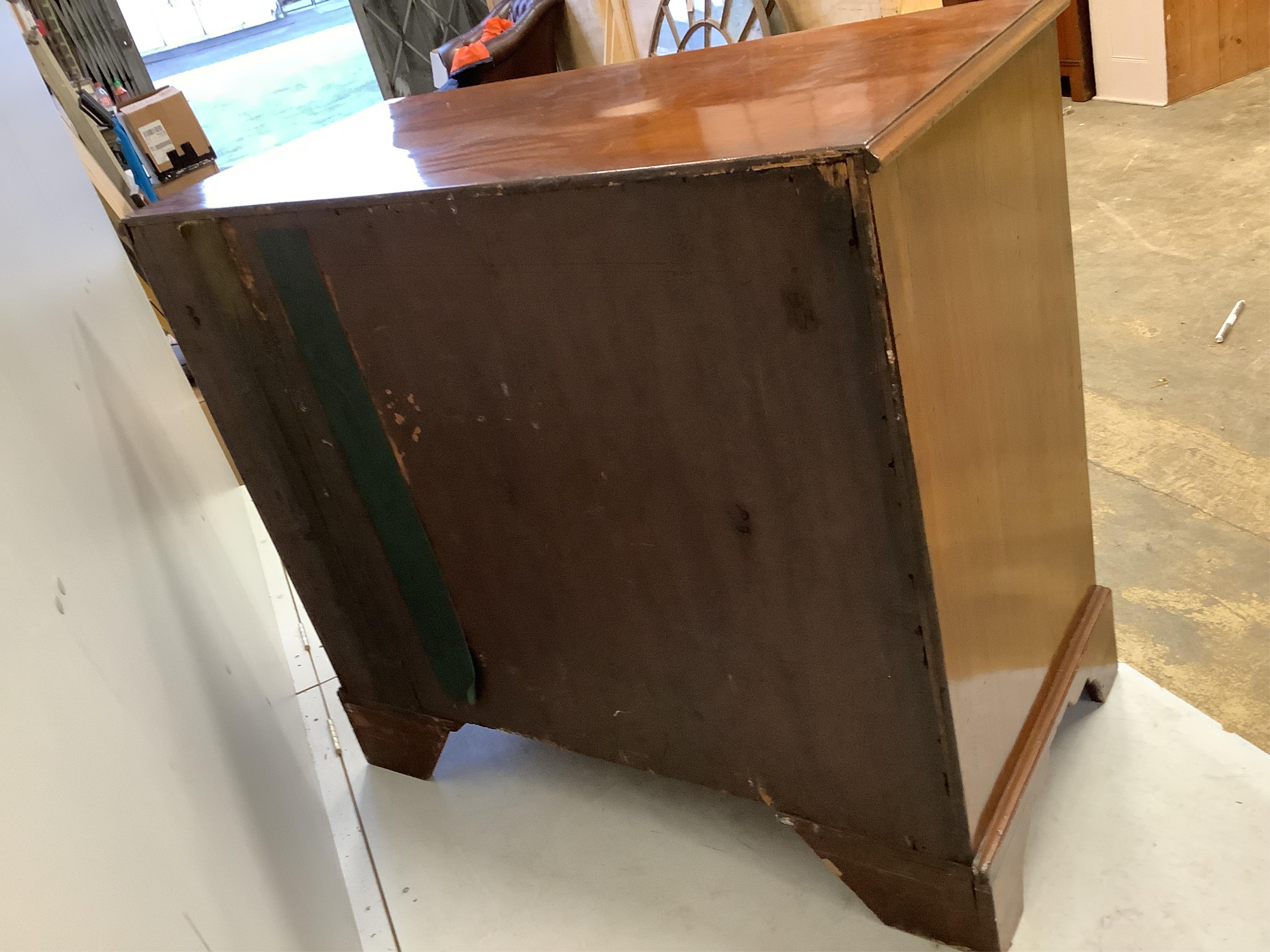 A George III mahogany chest of two short and three long drawers on bracket feet, width 114cm, depth 56cm, height 101cm. Condition - fair